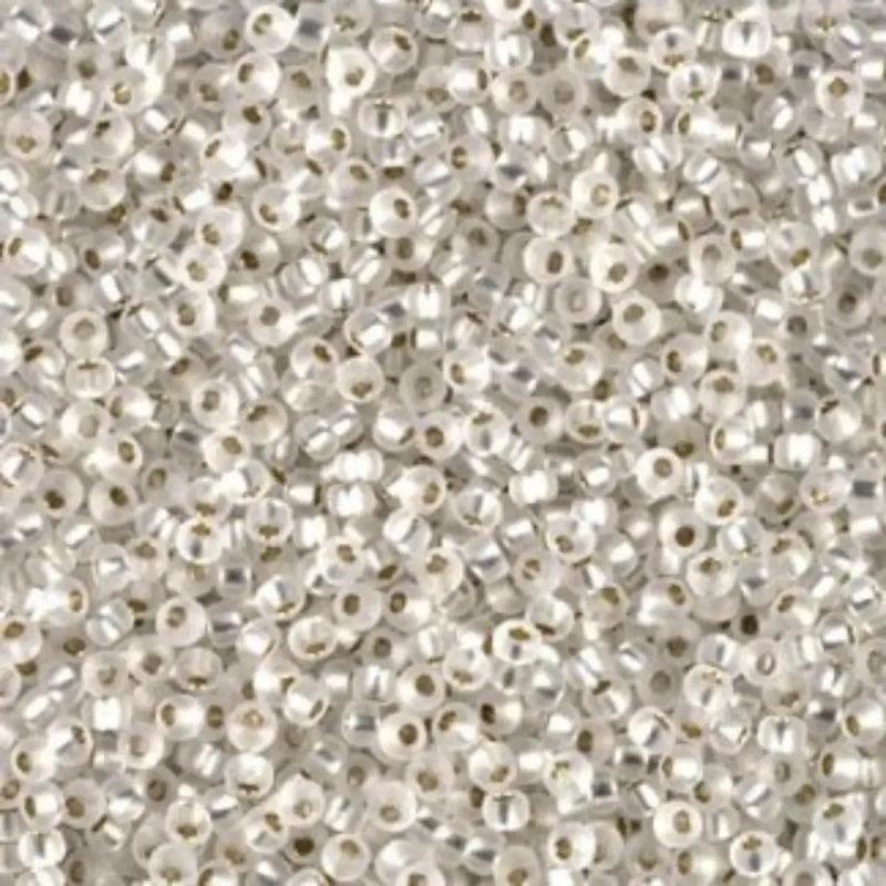 Close-up of small white beads on a white background