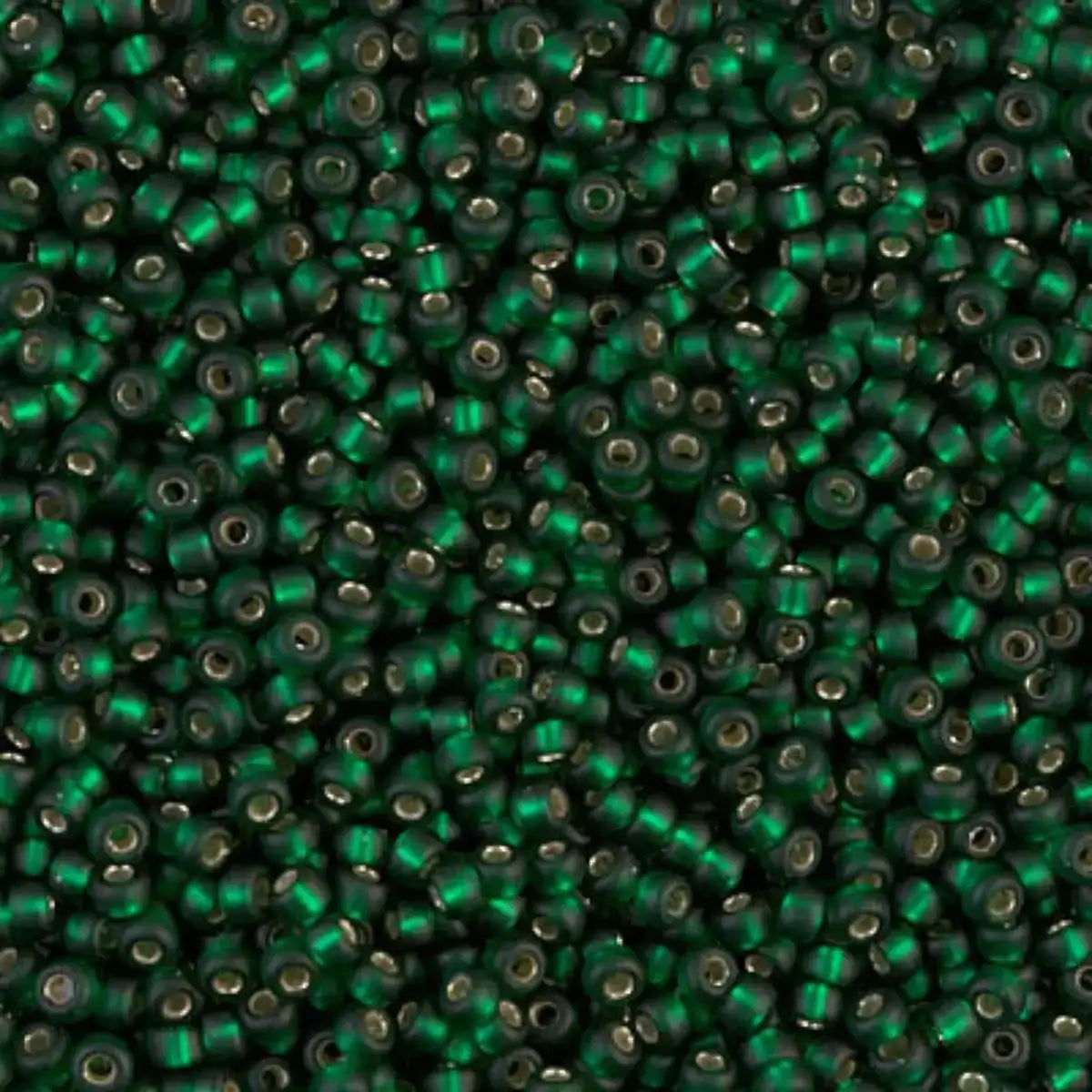 Close-up of green glass beads with a metallic sheen