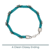 Turquoise beaded bracelet with silver clasp on a white background