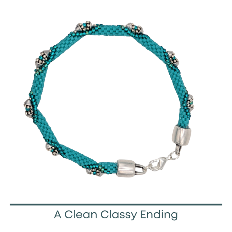 Turquoise beaded bracelet with silver clasp on a white background