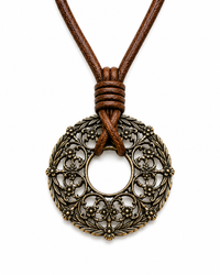 Bronze pendant necklace with brown leather cord on a white background