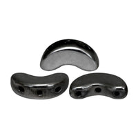 Three glossy black curved glass beads with two circular holes, shown from different angles on a plain white background.