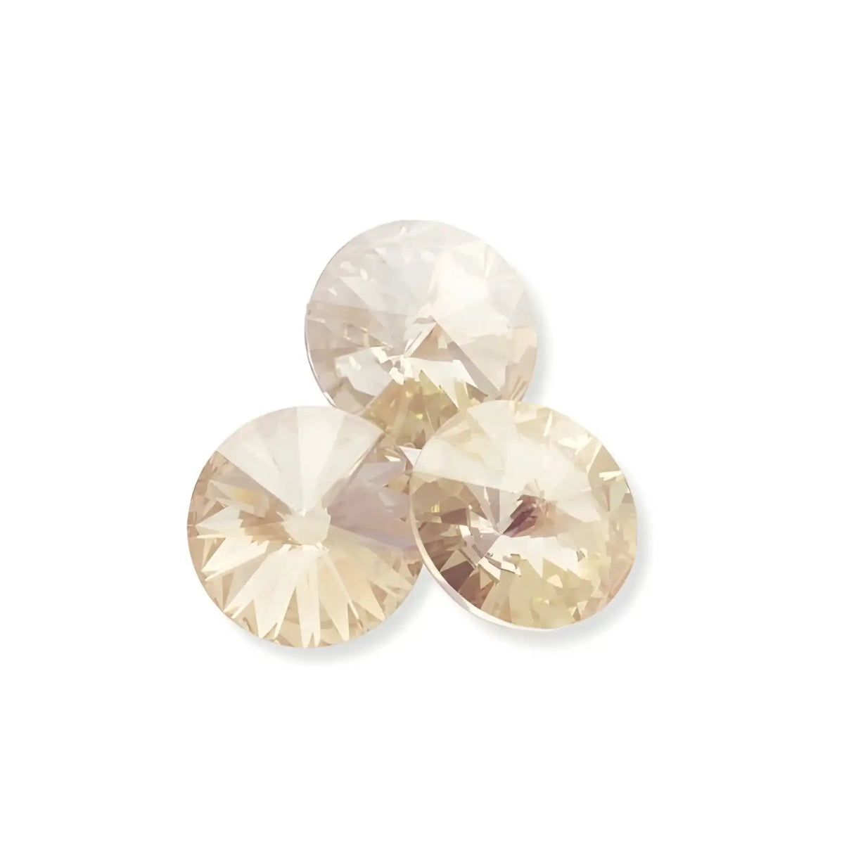 Three round champagne-colored faceted crystal gemstones on white background