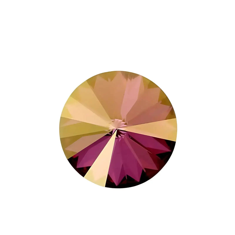 Round faceted gemstone with lilac and gold shadow hues on white background