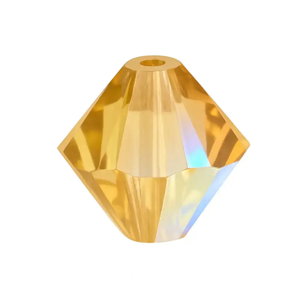 Light Colorado Topaz Shimmer bicone crystal bead with faceted geometric design on white background
