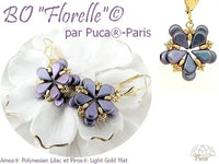 Flower-shaped earrings with gold accents on a white background, featuring the brand 'Puca Paris'.