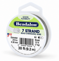 A spool of Beadalon 7-strand bead stringing wire, 30 feet long, with a white plastic spool and a green and white label showing product details.