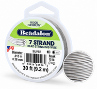 Beadalon 7 strand silver bead stringing wire on a white spool, with a circular inset showing the detailed texture of the silver wire strands.