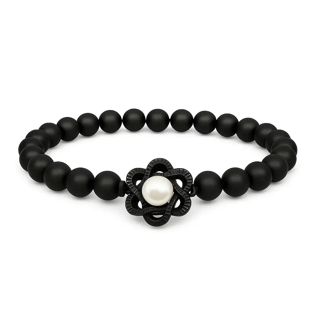 Black beaded bracelet with a central pearl and black flower-shaped clasp on a white background