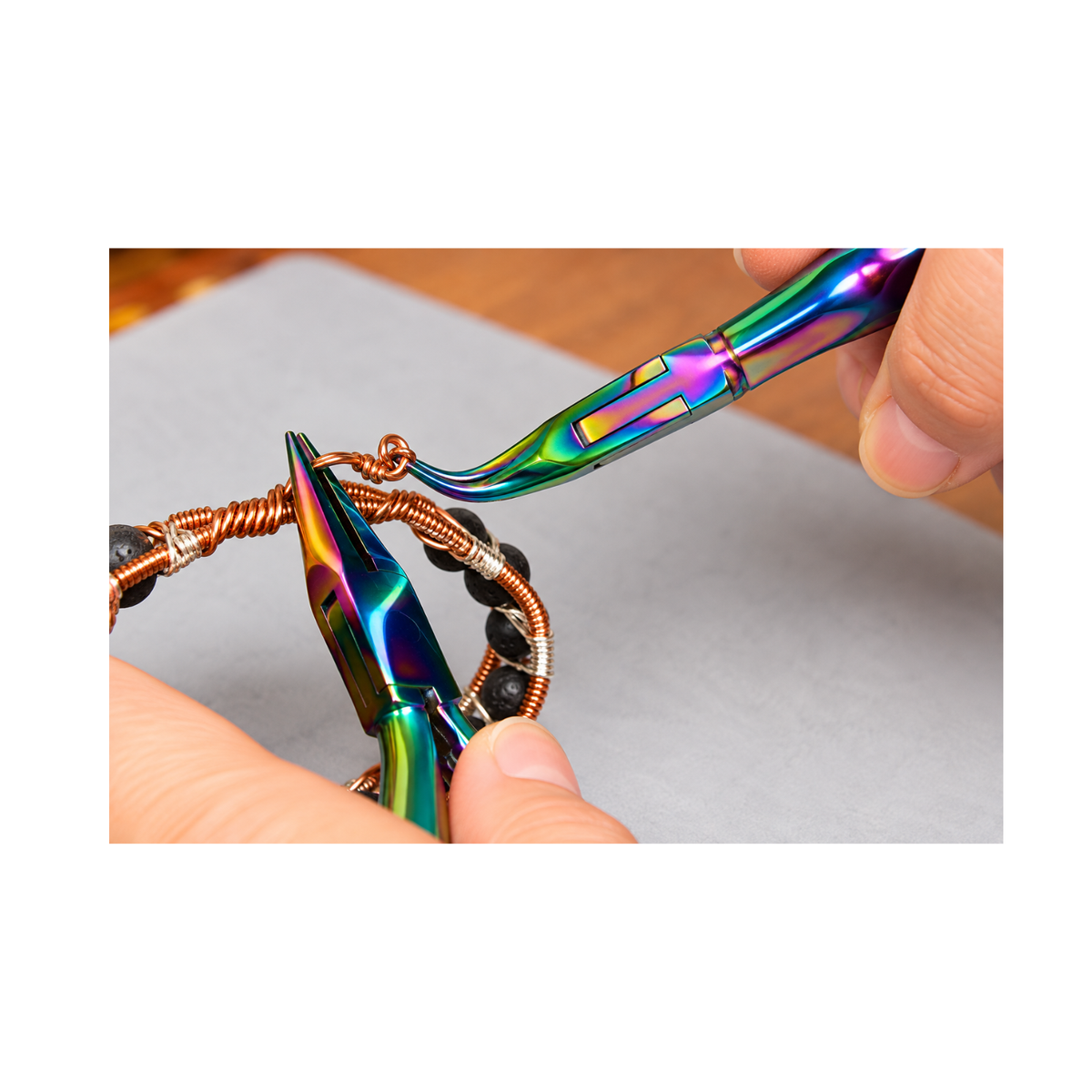 Chroma Series Chain Nose Pliers being used to shape copper wire and secure jewelry findings during handmade jewelry making