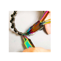Chroma Series rainbow flush cutters being used to trim wire during handmade jewelry making