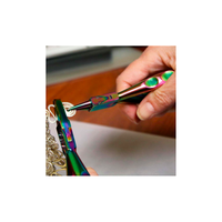 Chroma Series rainbow round nose pliers being used to shape wire loops for handmade jewelry