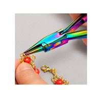 Chroma Series Round Concave Pliers being used to shape gold jewelry findings with red beads and chain components