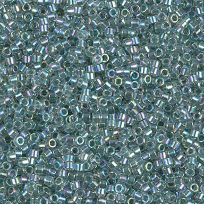 Close-up of small turquoise beads with a subtle iridescent sheen.