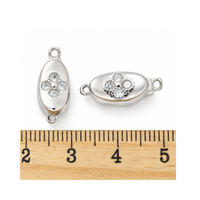 Platinum Elara pinch release bayonet peanut clasp shown beside a ruler for size reference