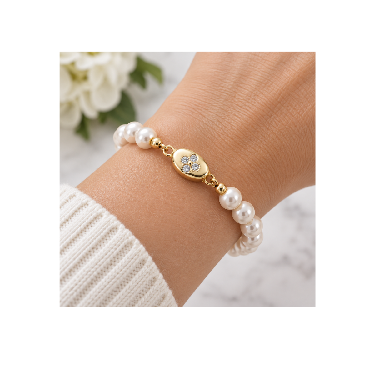Gold Elara cubic zirconia clasp used in a pearl bracelet on a wrist for design inspiration