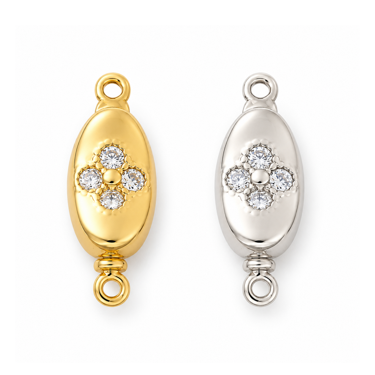 Gold and platinum Elara pinch release bayonet peanut clasps with cubic zirconia on a white background