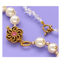 French Wire used to attach a decorative gold clasp to a pearl and crystal beaded bracelet