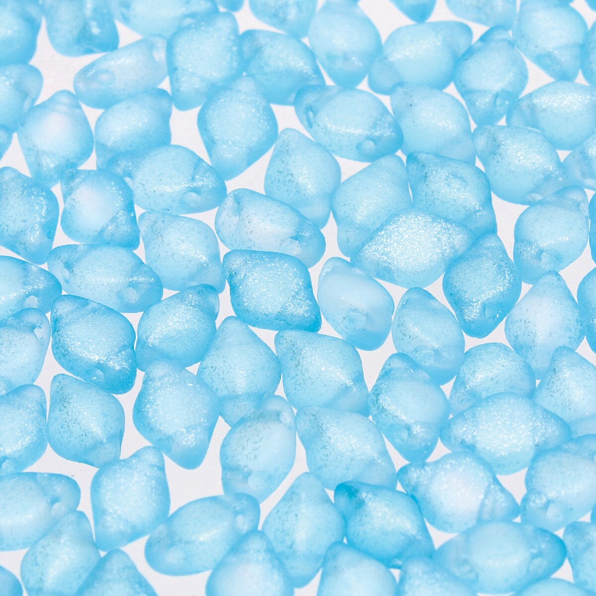 Close-up of blue 2-hole beads on a white background