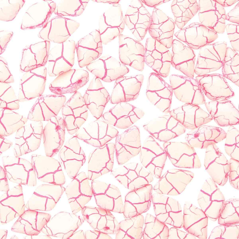 Pattern of pink and white cracked 2-hole beads on a white background
