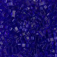Close-up of dark blue small plastic beads with two holes used for jewelry making and crafts