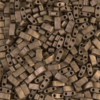 Close-up of small matte metallic bronze rectangular beads with two holes for jewelry making
