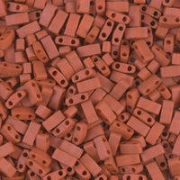 Close-up of small rectangular reddish-brown glass beads with two holes
