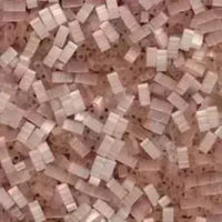 Close-up of beige and light brown mosaic tile pattern with rectangular tiles on brown grout