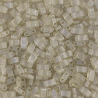 Close-up of translucent, pale beige two-hole rectangular beads for jewelry making