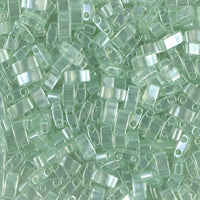 Close-up of translucent pale green rectangular glass seed beads with two holes