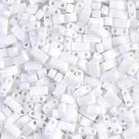 Close-up of white plastic two-hole bead spacers used for jewelry making