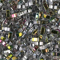 Close-up of shiny metallic beads with reflective surfaces in silver and gold tones