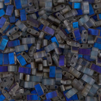 Close-up of small rectangular blue and gray glass mosaic beads with two holes