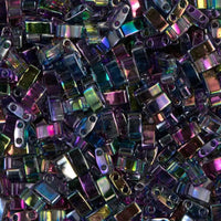 Close-up of iridescent glass rectangular beads with dual holes in various colors for jewelry making