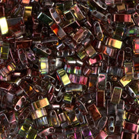 Close-up of multicolored rectangular glass beads with reflective surfaces and small holes