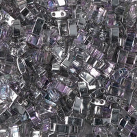 Close-up of shiny metallic and translucent purple rectangular beads for crafting and jewelry making