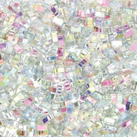 Close-up of iridescent rectangular sequins in pastel shades scattered densely