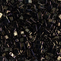 Close-up of shiny black rectangular beads with double holes for jewelry making