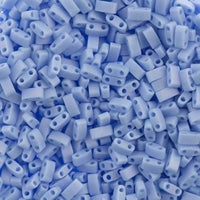 Close-up of sky blue two-hole rectangular plastic beads for jewelry making