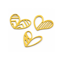 Three gold-colored metal heart-shaped cutouts with different internal line patterns, arranged on a plain white background.
