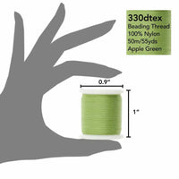 Green spool of beading thread with dimensions on a gray hand outline