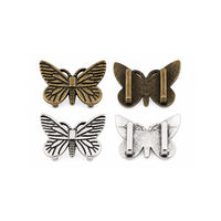Large butterfly sliders in Antique Silver and Antique Bronze showing front design and two slider bars on the back.