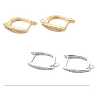 Two pairs of rectangular hoop earrings with embedded clear stones, one gold and one silver