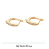 Pair of 18K gold plated hoop earrings with embedded crystals on white background
