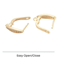 Gold-tone hoop earrings with embedded small crystals and easy open/close clasp design on white background