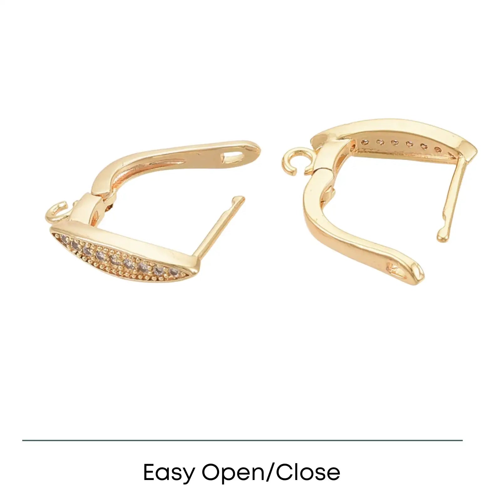 Gold-tone hoop earrings with embedded small crystals and easy open/close clasp design on white background