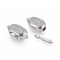 Platinum Luna bayonet peanut clasp shown open with removable clasp pin and cubic zirconia detail
