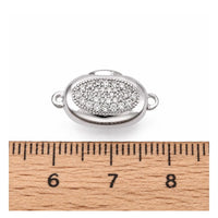 Platinum Luna bayonet peanut clasp shown beside a ruler for size reference