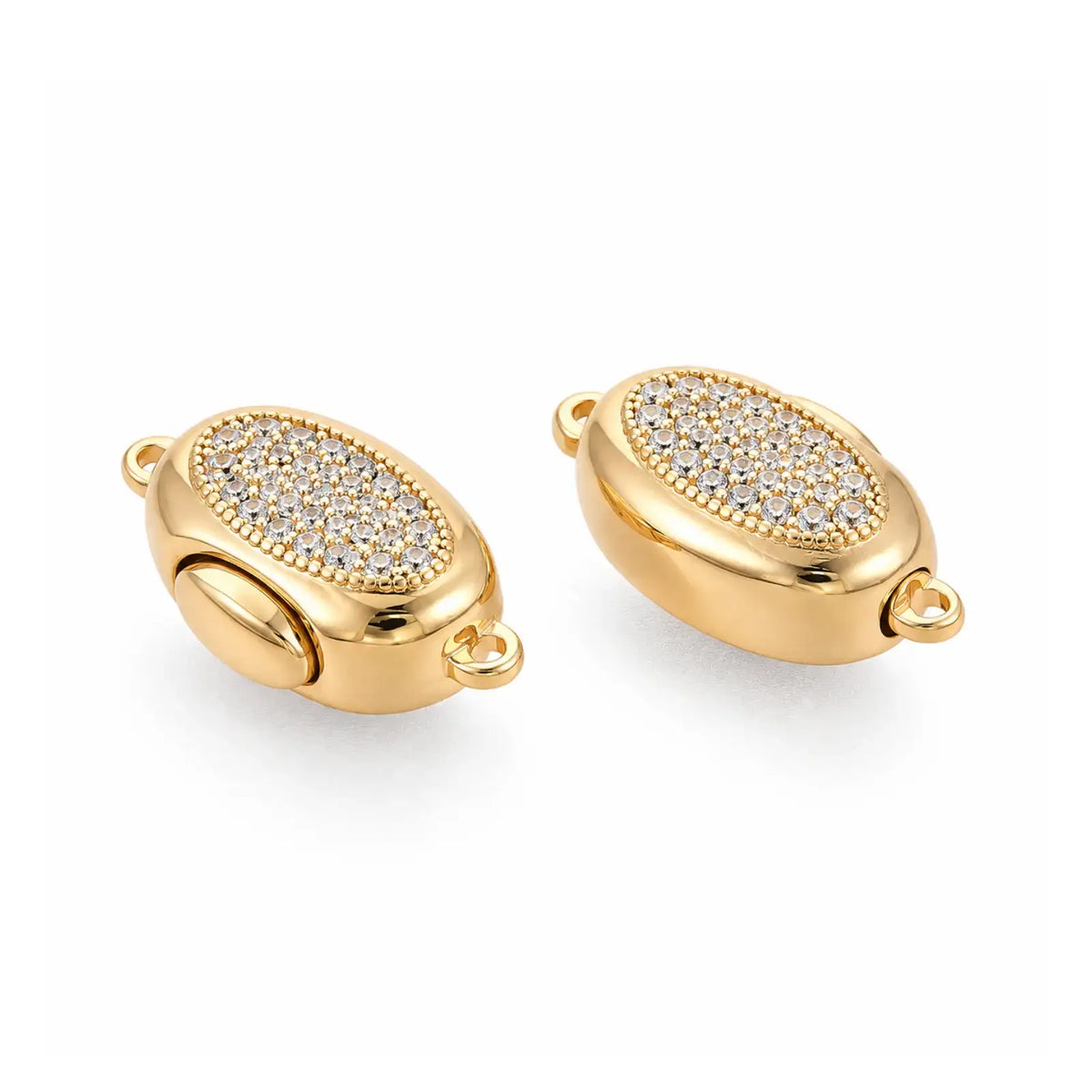 Gold Luna bayonet peanut clasp with clear cubic zirconia shown from an angled detail view
