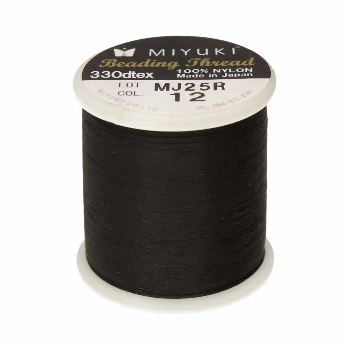 Spool of Miyuki beading thread on a white background